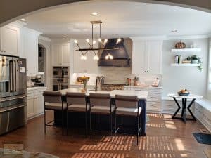kitchen design with large island and chandelier